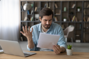 man puzzling over contract